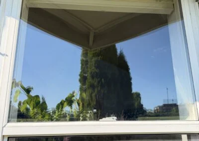 Double-hung window with new clear glass and a screen