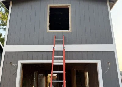 Garage gable with an open window frame before install