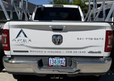 Rear of a white Apex Glass pickup with glass rack
