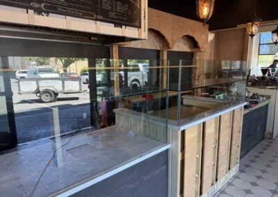 Restaurant counter with clear glass guard panels