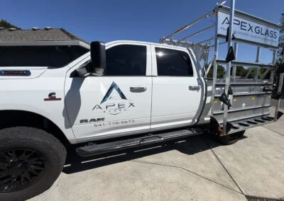 White Apex Glass pickup truck with aluminum glass rack